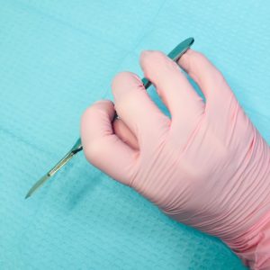 how to hold a dermaplaning tool for aestheticians